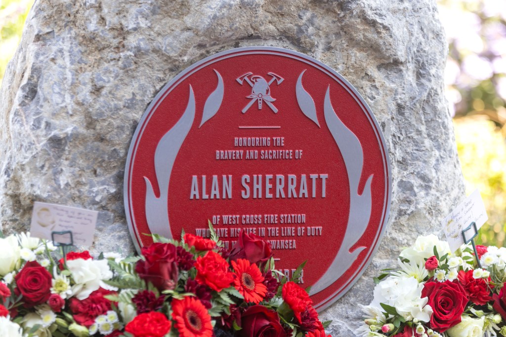 Detail of Alan Sherratt’s Red Plaque in Swansea, honouring his sacrifice and service to the community.