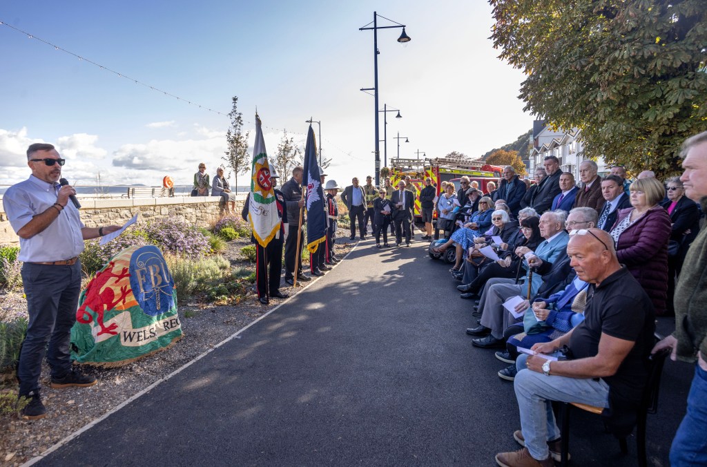 Public gathering at Alan Sherratt’s memorial ceremony in Swansea, marking 53 years since his death in the line of duty.