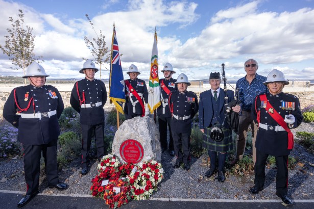 Ceremonial colour parade of firefighters at Alan Sherratt’s Red Plaque unveiling in Swansea, honouring his service and sacrifice.