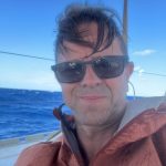 Leigh Evans seated on the deck of the flotilla yacht during preparations for the Gaza aid mission.