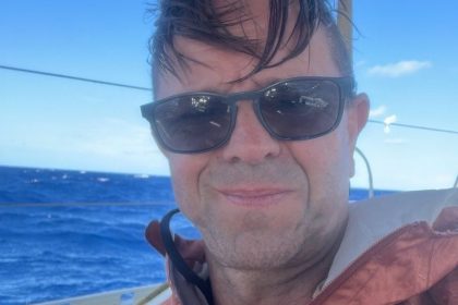 Leigh Evans seated on the deck of the flotilla yacht during preparations for the Gaza aid mission.