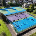 Overhead view of children playing on the revitalised Blakemore court in South West Wales, showcasing the impact of Sport Wales’s Court Collaboration Fund on local youth engagement.