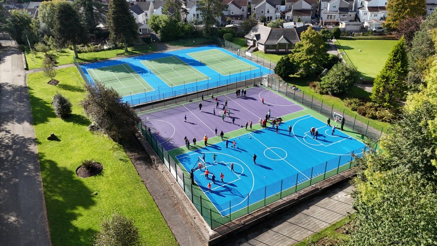 Overhead view of children playing on the revitalised Blakemore court in South West Wales, showcasing the impact of Sport Wales’s Court Collaboration Fund on local youth engagement.