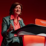 Eluned Morgan addressing the Labour Party conference from the lectern, outlining Welsh Labour’s vision for stability and delivery ahead of the Senedd election.