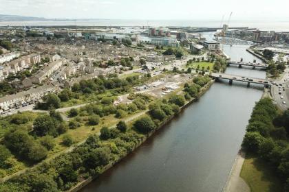 Drone image shows Swansea’s St Thomas riverside site and waterfront district, where plans propose 158 new homes and public realm regeneration.