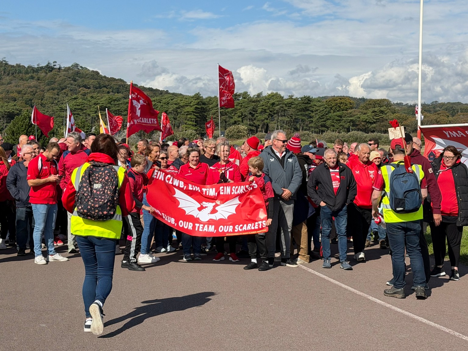 Fans in Scarlets colours prepare to set off