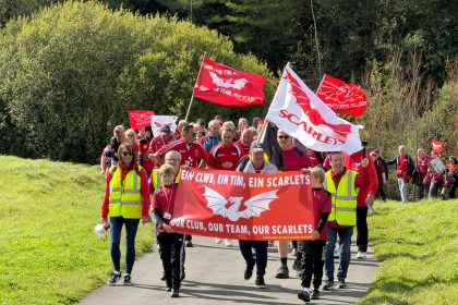 The march with banners and flags held high