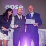 Chris Owens of Neath Port Talbot Council holding the APSE 2025 Award at the ceremony in Glasgow, recognising the council’s AI innovation in adult social care.