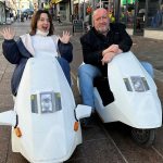 Actors Ruth Jones and Steve Speirs riding Sinclair C5s during filming for BBC Cymru Wales’ From Porthcawl with Love, a nostalgic look at Jones’ hometown of Porthcawl.