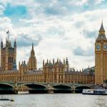 brown concrete building near body of water