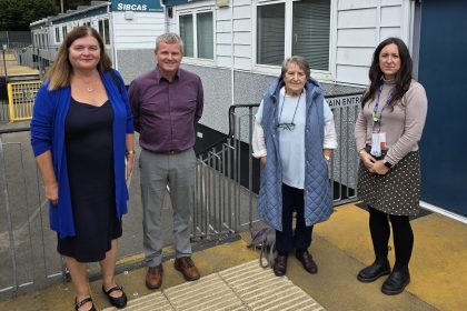 Plaid Cymru MS Sioned Williams pictured with school leaders and Cllr Rosalyn Davies at Godre’r Graig Primary School’s temporary site in Pontardawe, September 2025.