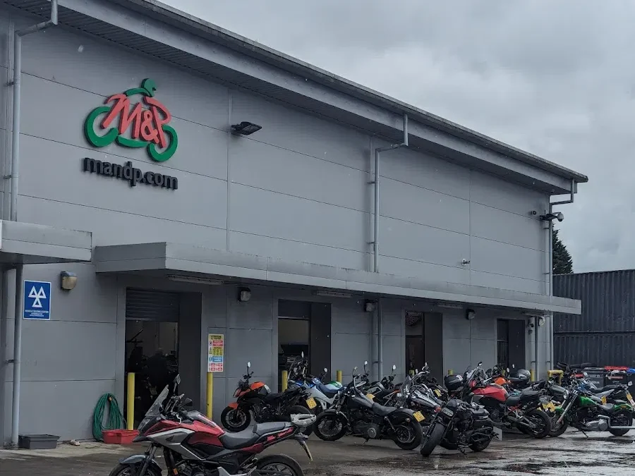 Motorcycles parked outside the M&P Direct building on Phoenix Way, Garngoch Industrial Estate, Swansea. The long‑established dealership closed in September 2025 after nearly five decades of trading.