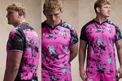 Model wearing the Ospreys’ 2025/26 European rugby kit — a striking pink and black Macron design made from recycled fabrics.