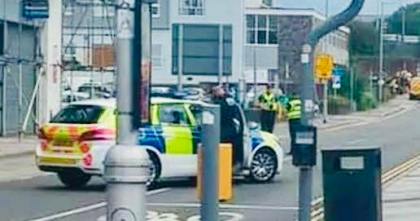 A South Wales Police car parked across Tremains Road in Bridgend, closing the street following the discovery of an unexploded ordnance device.