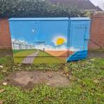 Painted utility box in Mumbles featuring colourful artwork inspired by local history and culture, part of a community art project.