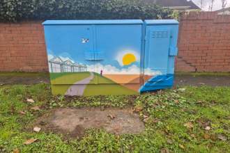 Painted utility box in Mumbles featuring colourful artwork inspired by local history and culture, part of a community art project.