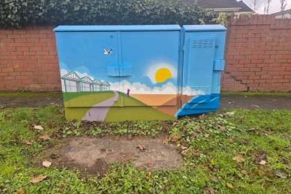 Painted utility box in Mumbles featuring colourful artwork inspired by local history and culture, part of a community art project.