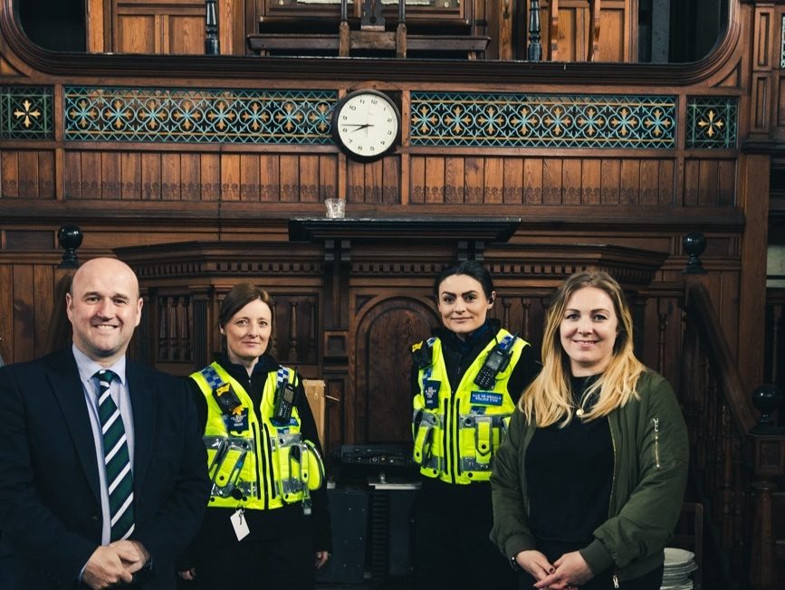 Police and Crime Commissioner Dafydd Llewellyn with two officers and Pastor‑elect Heulwen Davies inside Siloah Chapel, supporting its restoration as a community hub.
