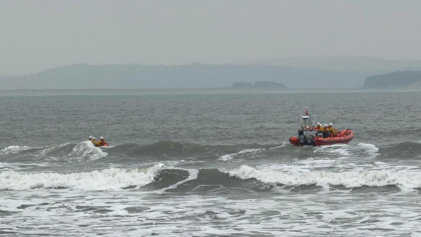 Two Burry Port RNLI lifeboats pictured in choppy waters during their 80th call‑out of 2025, launched after reports of a kite surfer in difficulty off Pembrey.