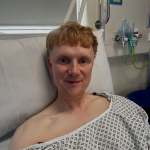 BBC presenter Owain Wyn Evans wearing a hospital gown in Cardiff’s Llandough Hospital after emergency gallbladder surgery.
