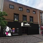 Artist’s impression of The Hanbury pub showing a black‑painted exterior with a large mural design and new signage as part of the Kingsway regeneration.