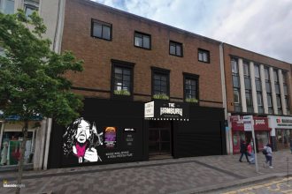 Artist’s impression of The Hanbury pub showing a black‑painted exterior with a large mural design and new signage as part of the Kingsway regeneration.