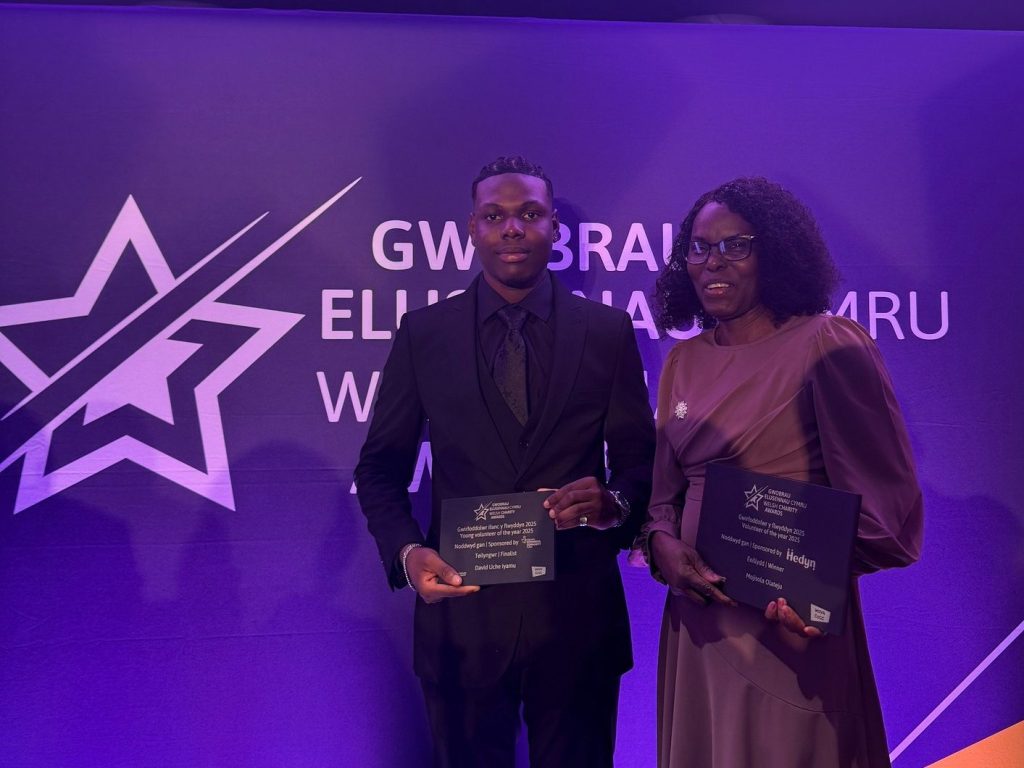 Mojisola Olateju and David Uche Iyamu standing together at the Welsh Charity Awards ceremony.