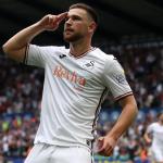 Zan Vipotnik on the pitch during a Swansea City match, running with the ball in an attacking move. Image: Swansea City AFC.