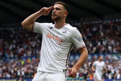 Zan Vipotnik on the pitch during a Swansea City match, running with the ball in an attacking move. Image: Swansea City AFC.