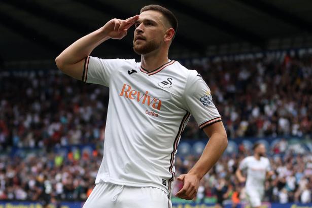 Zan Vipotnik on the pitch during a Swansea City match, running with the ball in an attacking move. Image: Swansea City AFC.