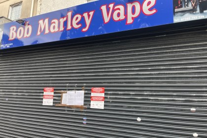 Closed Bob Marley Vapes store in Swansea city centre with shutters down and official council closure notices displayed.