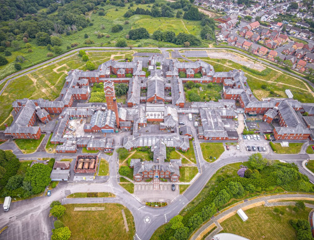 Drone image shows Cefn Coed Hospital site in Tycoch, where housing plans have been cut as land is retained for a new mental health unit.