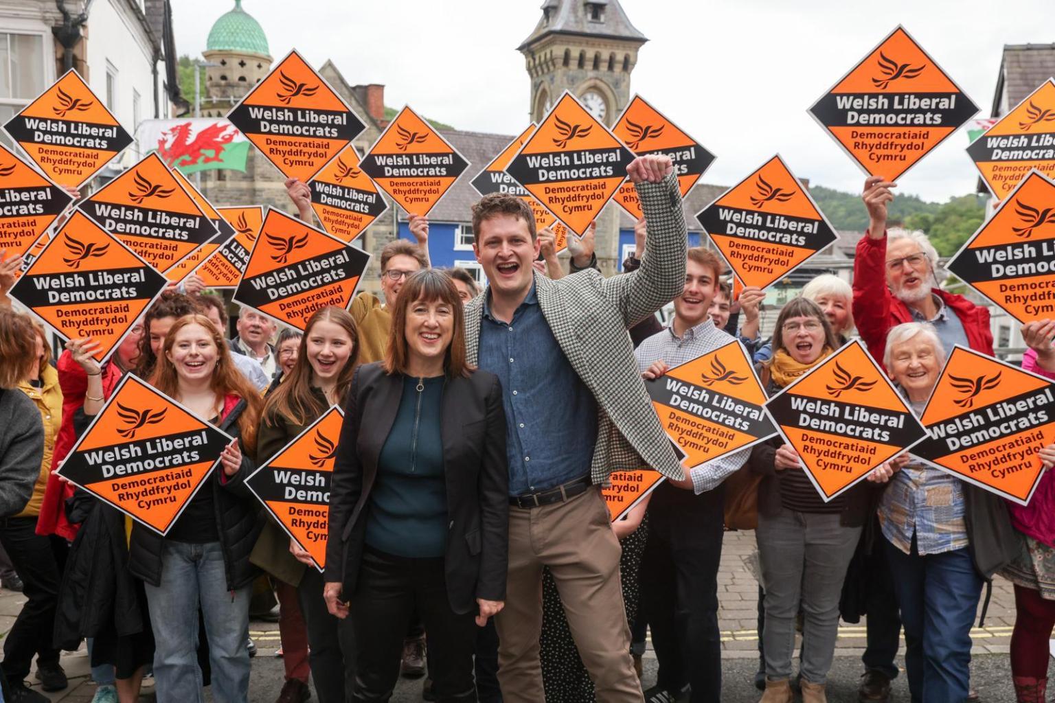 Welsh Lib Dem leaders David Chadwick and Jane Dodds posed with supporters in Wrexham, using the conference backdrop to call on disillusioned Conservatives to join their party as the new home for business and decency.