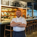 Acclaimed chef Jonathan Woolway showcases his skills at Swansea Market, preparing dishes with local produce during a free live cooking event.