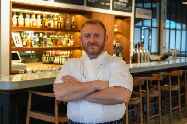Acclaimed chef Jonathan Woolway showcases his skills at Swansea Market, preparing dishes with local produce during a free live cooking event.