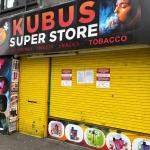 Kubus Vapes in Swansea closed by Trading Standards, with shutters down and closure notices attached following a crackdown on illegal vapes and tobacco.