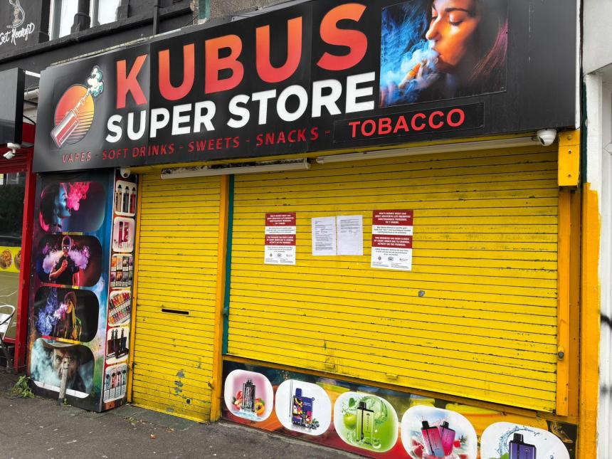 Kubus Vapes in Swansea closed by Trading Standards, with shutters down and closure notices attached following a crackdown on illegal vapes and tobacco.