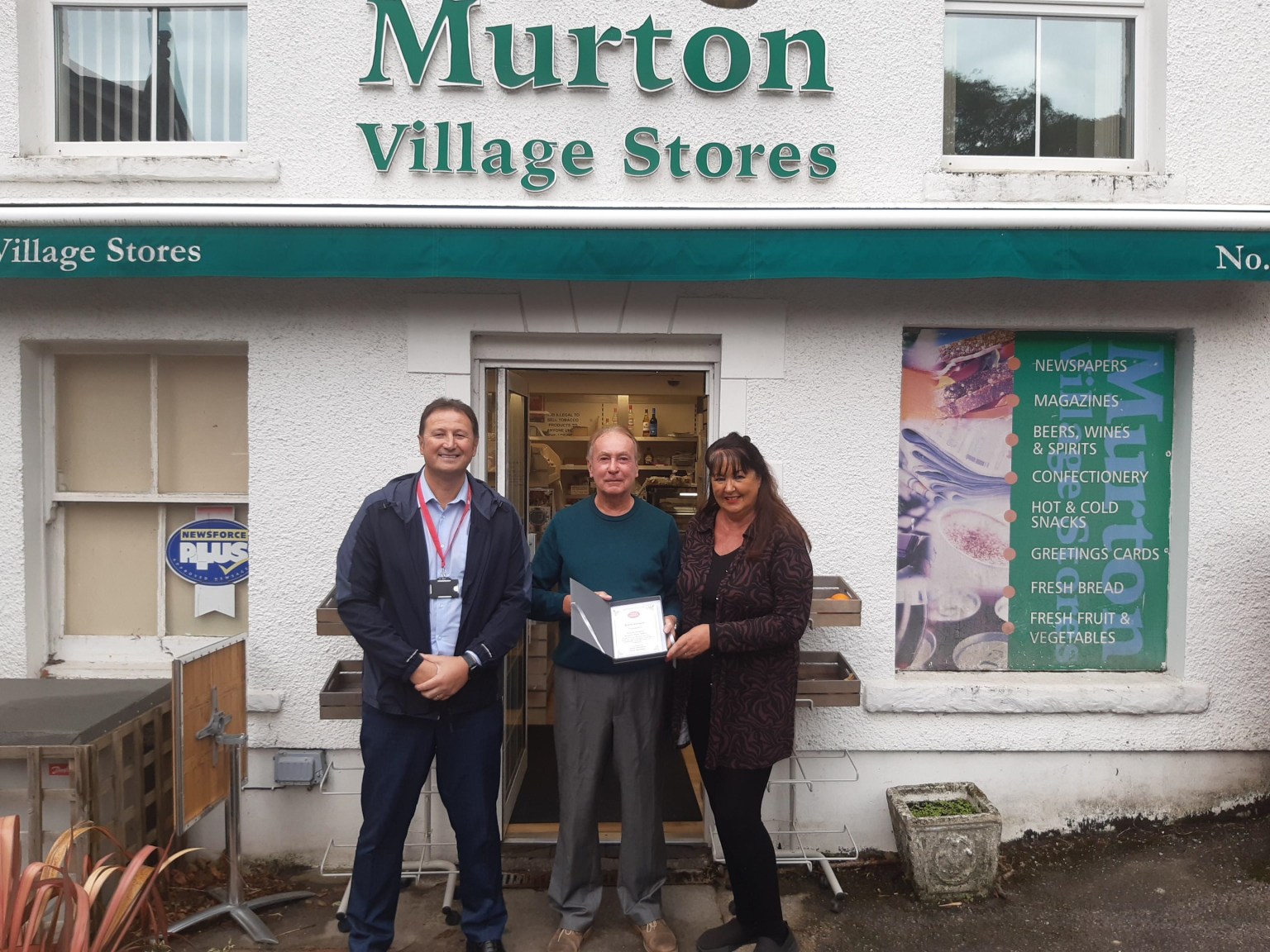 David and Helen Jenkins stand with Post Office Area Manager Ryan Leonard outside Murton Post Office to mark David’s retirement after nearly four decades.