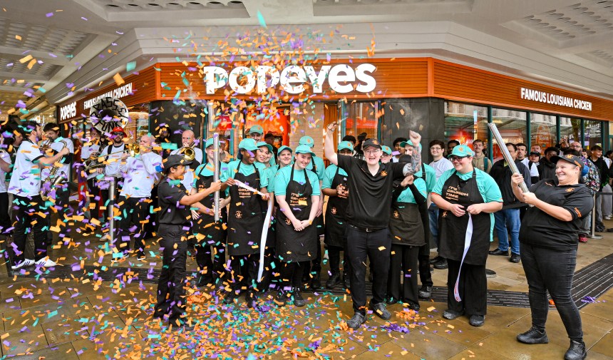 Crowds outside the new Popeyes restaurant on Oxford Street, Swansea, during its opening day on 3 October 2025.