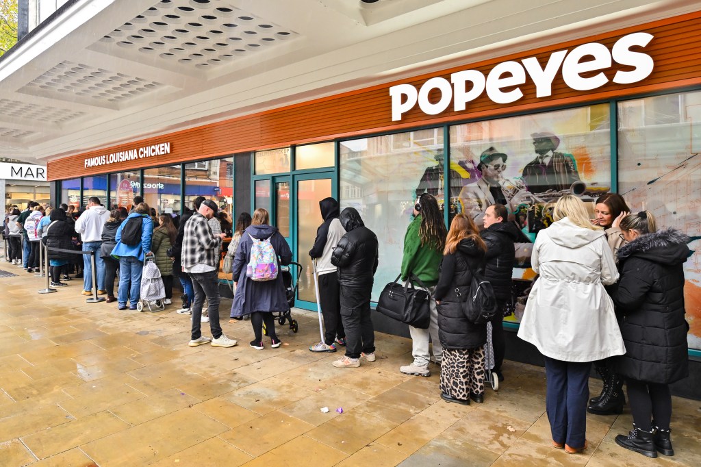 Crowds queuing along Oxford Street, Swansea, for the opening of the new Popeyes restaurant on 3 October 2025.