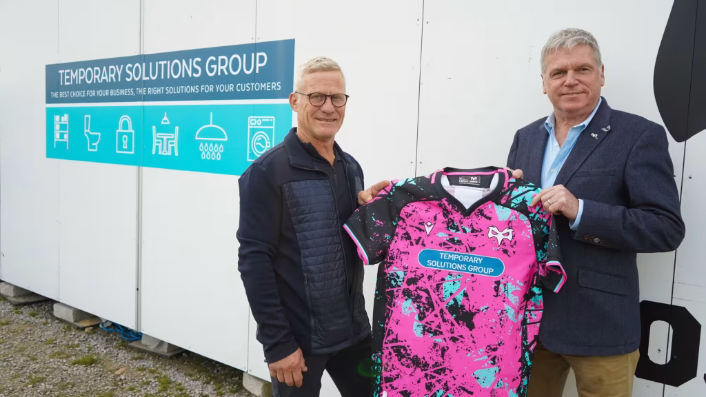 Stephen Trollope of Temporary Solutions Group and Ospreys Commercial Director Richard Lancaster hold the new 2025/26 European kit, showcasing TSG’s sponsorship on the front of the shirt.