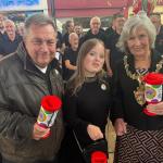 Lord Mayor Cheryl Philpott and Kev Johns launched the Just a Pound appeal at Swansea Market, joined by supporters and the Phoenix Choir of Wales