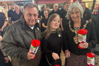 Lord Mayor Cheryl Philpott and Kev Johns launched the Just a Pound appeal at Swansea Market, joined by supporters and the Phoenix Choir of Wales