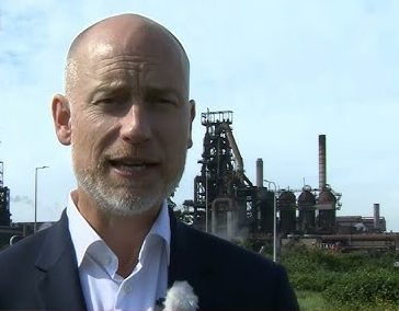 Stephen Kinnock MP standing in front of Port Talbot's Tata Steelworks
(Image: BBC)