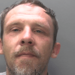 Custody photo of Swansea offender Johnathan Michael Jones, sentenced to 13 years for raping and sexually assaulting a vulnerable male victim.