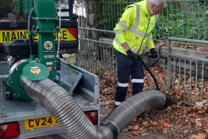 Leaf‑sucking and mulching machine on a trailer attached to a pick‑up truck, used by Swansea Council cleansing teams.