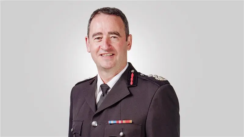 Chief Fire Officer Roger Thomas wearing his fire service uniform.