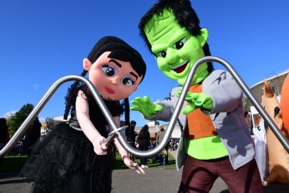 Frankenstein and Wednesday Addams characters entertain visitors at Swansea’s Spooks in the City Halloween event.