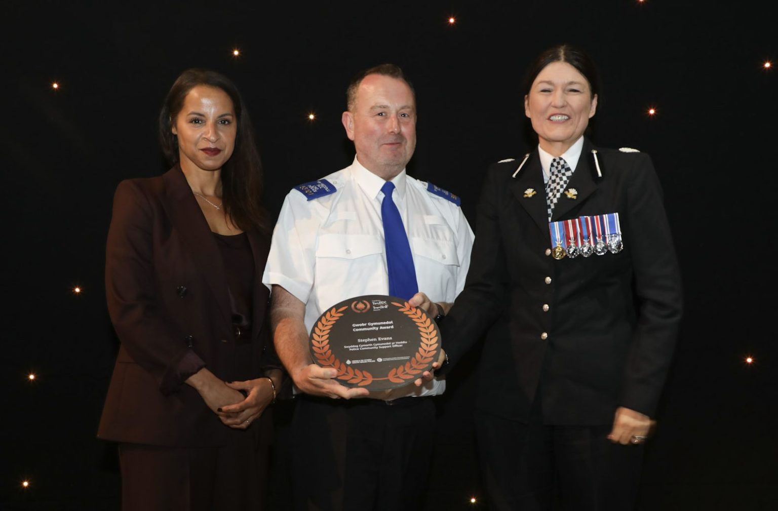 PCSO Stephen Evans pictured receiving his Community Award from South Wales Police.