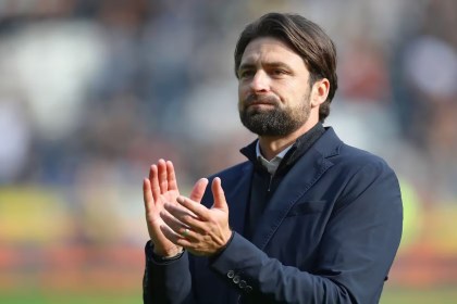 Russell Martin standing pitchside at the Swansea.com Stadium during his final weeks as Swansea City manager.